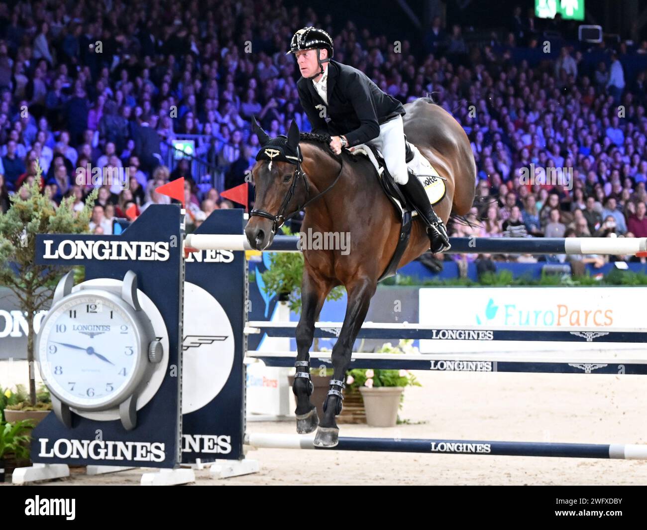 AMSTERDAM - Marcus Ehning with Stargold during the Longines FEI Jumping World Cup at the Jumping Amsterdam 2024 tournament at the RAI on January 28, 2024 in Amsterdam, the Netherlands. ANP | Hollandse Hoogte | GERRIT VAN COLOGNE Stock Photo