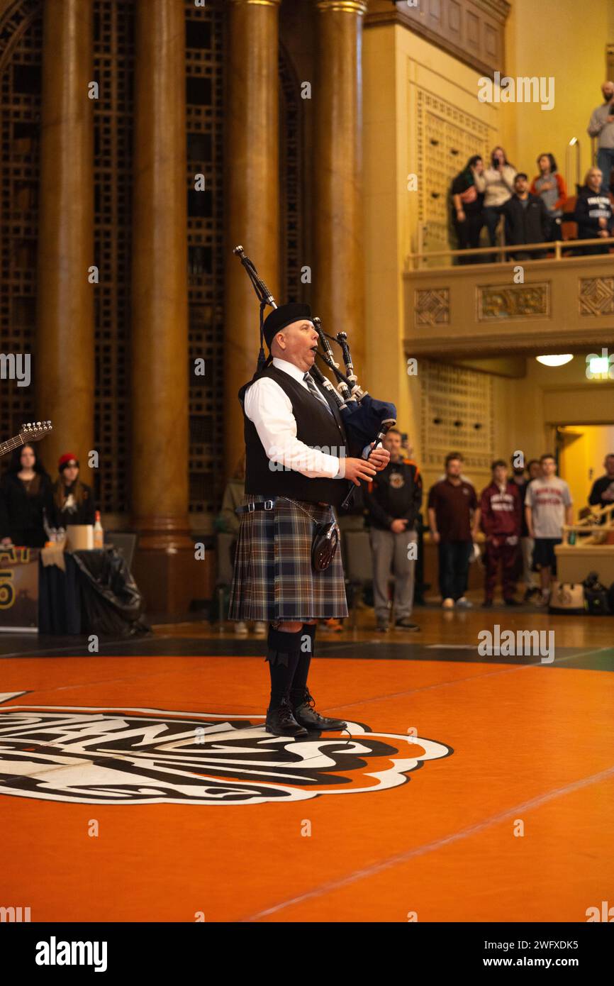 A local musician plays the Marine Corps Hymn on his bagpipes before the