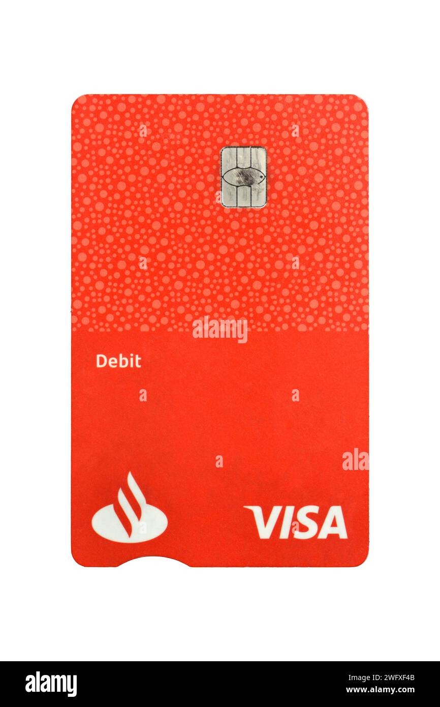 Santander Bank Poland used plain red Visa debit card isolated on white Stock Photo