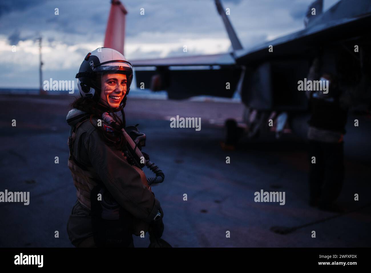 Lt. Chandalar Pensley from Anchorage, Alaska, assigned to Strike Fighter Squadron (VFA) 106 for initial carrier qualifications, stands by before conducting preflight checks on an F/A-18F Super Hornet on Nimitz-class aircraft carrier USS George Washington (CVN 73) Jan. 19, 2024. Stock Photo