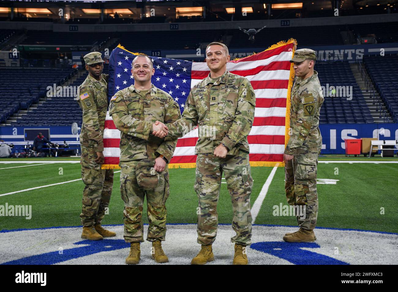 U.S. Army Staff Sgt. Christopher Eckelkamp poses with Indiana National Guard Capt. Aaron Sykora after extending his service at Lucas Oil Stadium in Indianapolis, Jan. 6, 2023. Eckelkamp has more than 15 years of faithful and selfless service. (Indiana National Guard Stock Photo
