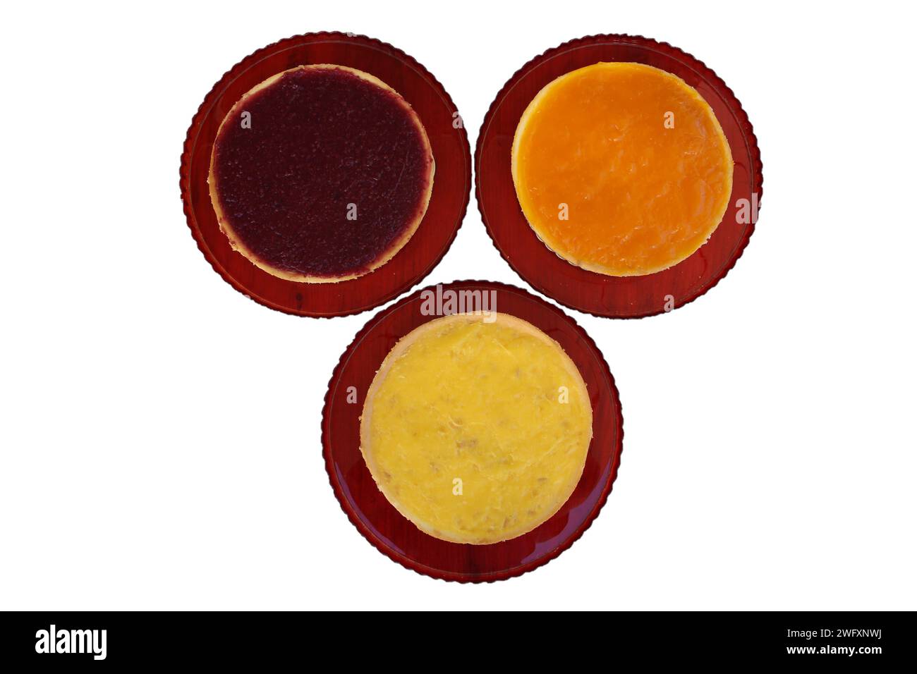 cheesecakes isolated on white background, Raspberry, lemon and orange cheesecake Stock Photo
