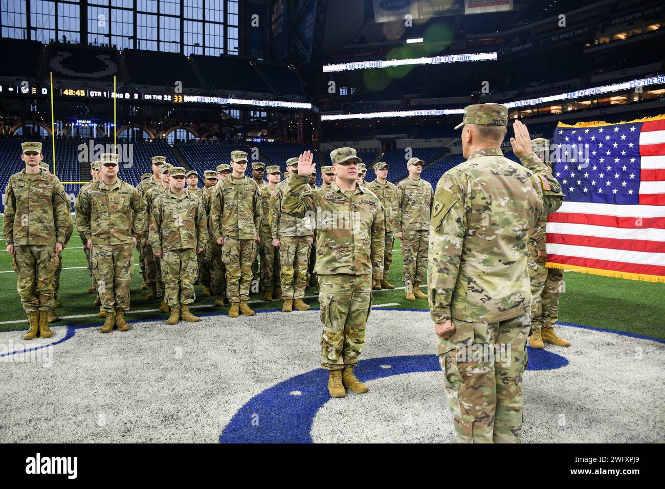 Indiana National Guard Capt. Aaron Sykora administers the oath of enlistment to U.S. Army Staff Sgt. Christopher Eckelkamp at Lucas Oil Stadium in Indianapolis, Jan. 6, 2024. The oath of enlistment is a military oath made by all members of the U.S. armed forces who enlist to serve. (Indiana National Guard Stock Photo
