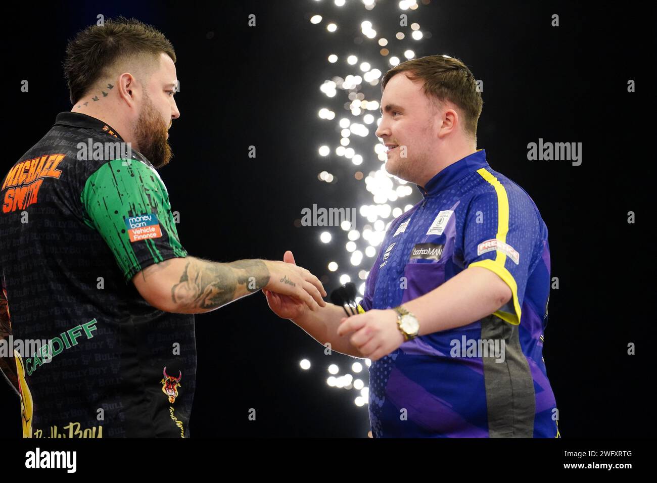 Luke Littler (right) congratulates Michael Smith following his victory