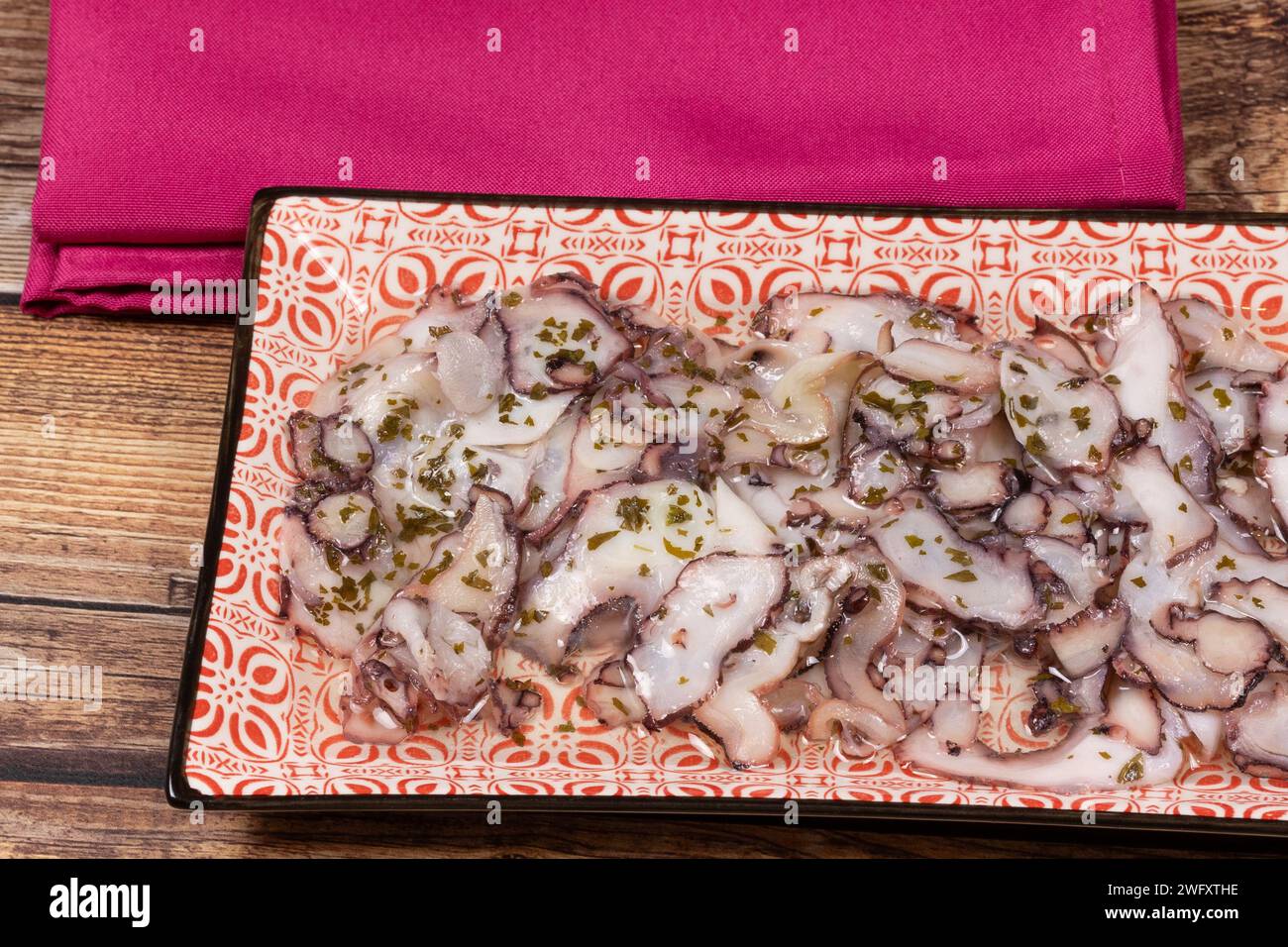 octopus carpaccio, close-up, in a dish Stock Photo