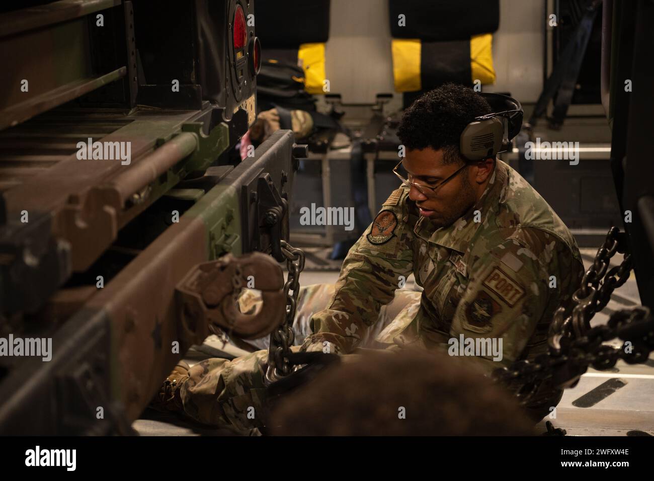 A U.S. Air Force aerial port specialist secures an Avenger Air Defense ...