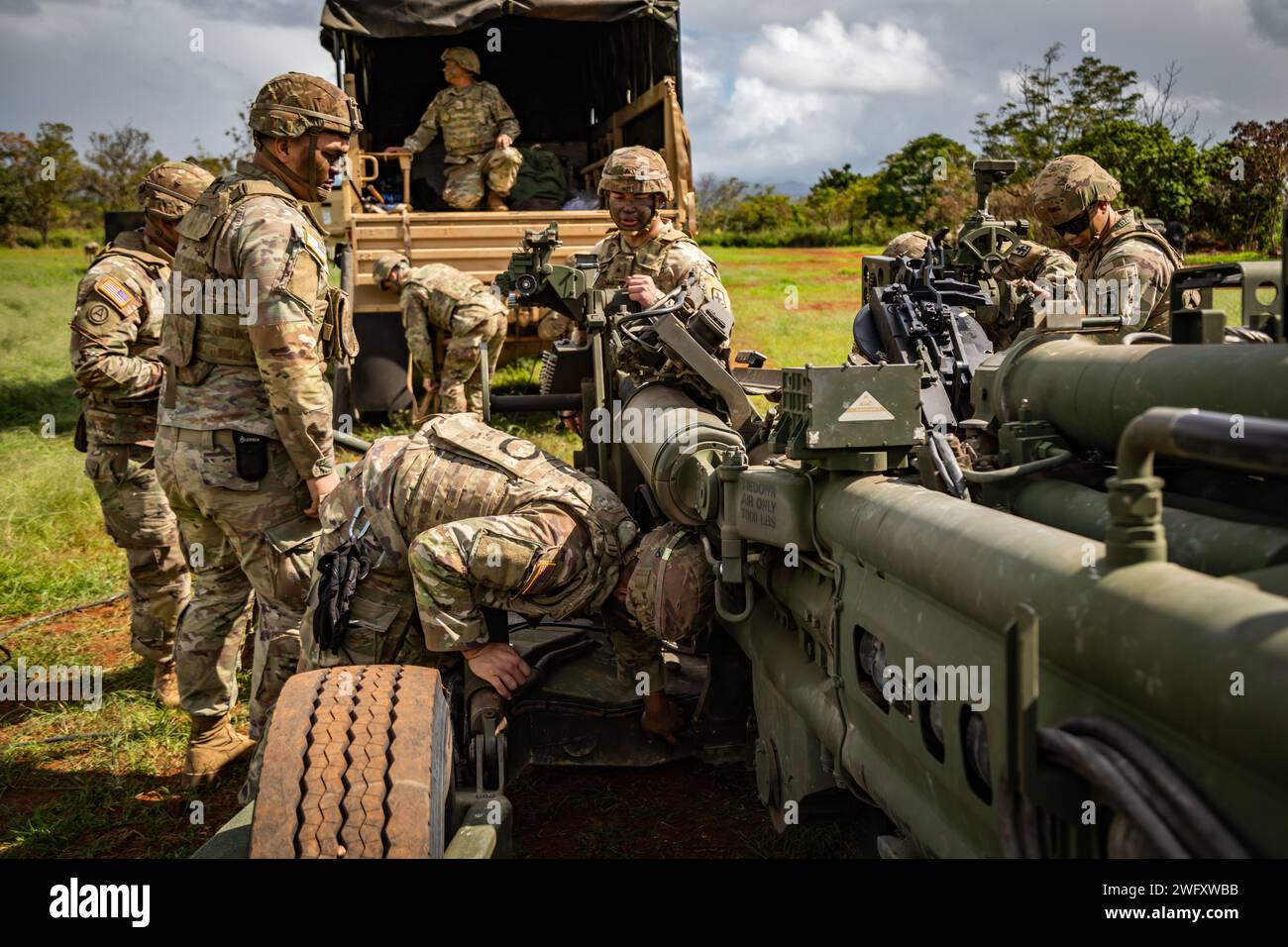 U.S. Soldiers assigned to Charlie Company, 1st Battalion, 487th Field Artillery Regiment (1-487 FA), 29th Brigade Support Battalion, Hawaii Army National Guard conduct fire support certification at Schofield Barracks, Hawaii, Jan. 6, 2024. Soldiers conduct certification on various weapon platforms to maintain proficiency to validate combat capabilities and readiness. Stock Photo