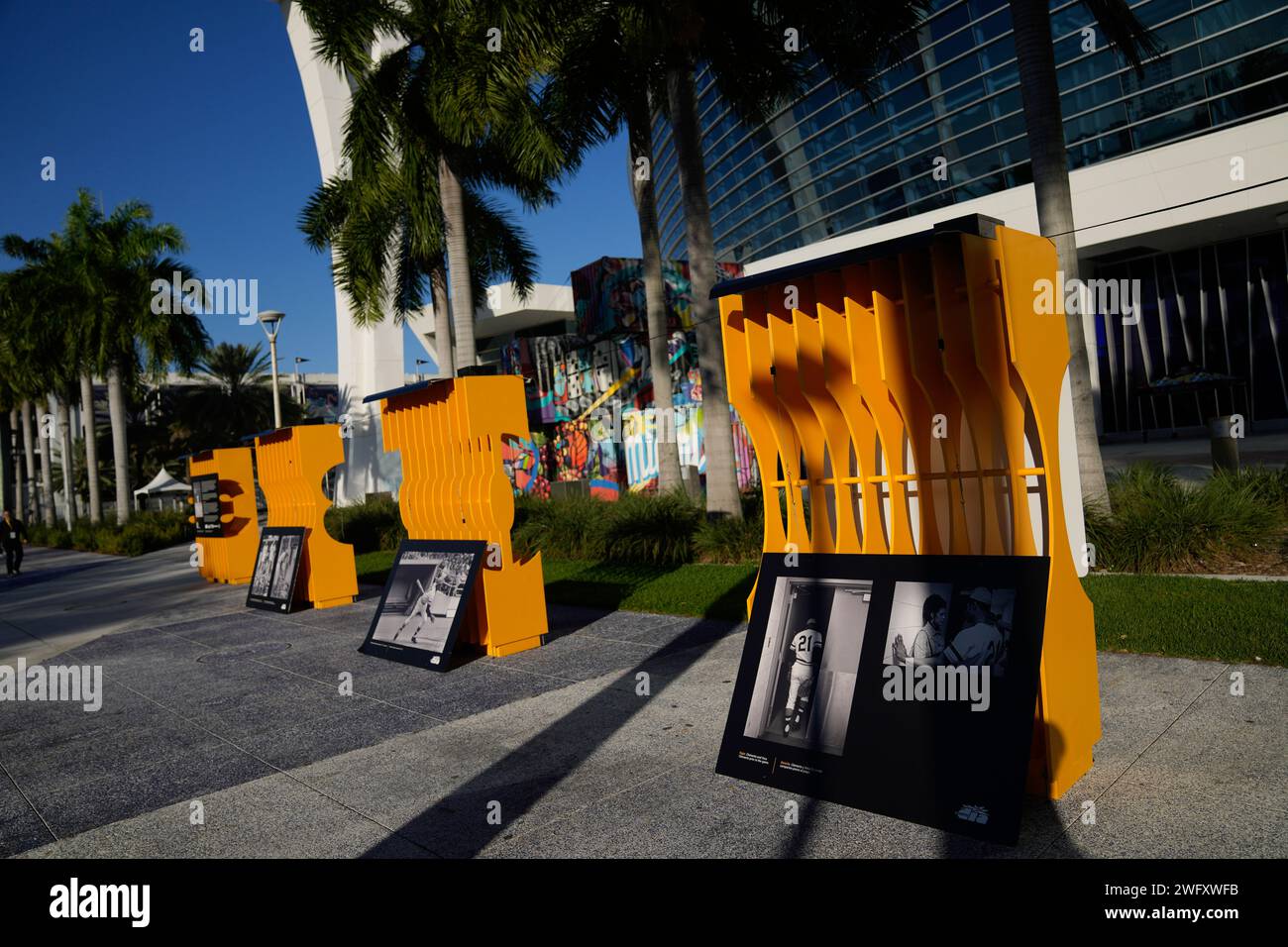 Images from Roberto Clemente's Major League Baseball career sit lined