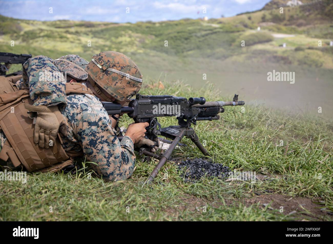 U.S. Marines with Marine Wing Support Squadron (MWSS) 174, Marine Aircraft Group 24, 1st Marine Aircraft Wing, fire M240-B and M2 .50-caliber machine guns at the Marine Corps Air Station Kaneohe Bay range, Hawaii, Jan. 16, 2024. The training provided an opportunity for Marines with MWSS-174 to get hands-on training and familiarization with the employment of crew-served weapons. Stock Photo