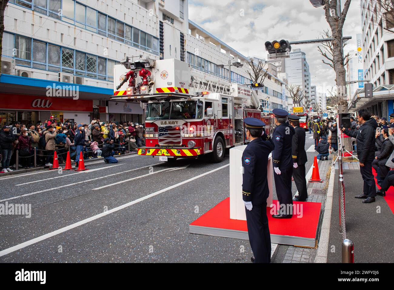 YOKOSUKA, Japan (January 7, 2024) - Yokoska city officials salute a ...