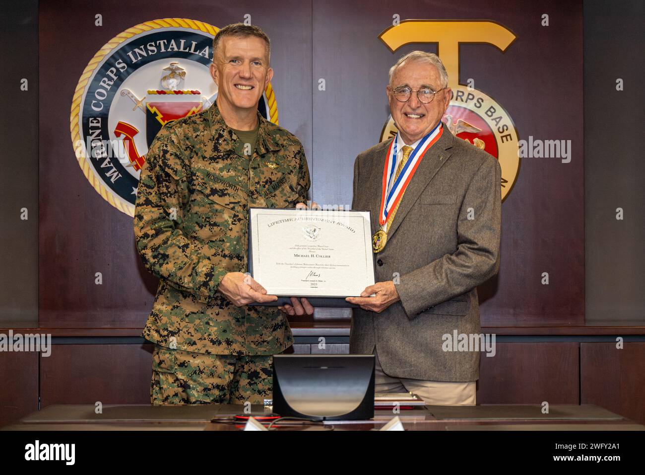 U.S. Marine Corps Brig. Gen. Jason Woodworth, left, commanding general