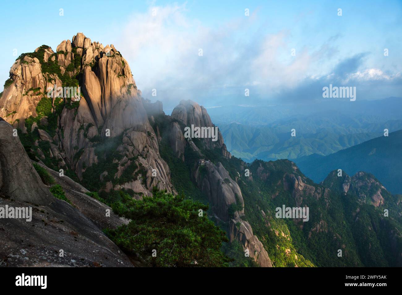 Lotus Peak, also known as Lianhua Feng, stands at 6,115 feet as the tallest summit in the Huangshan mountain range in China. Stock Photo