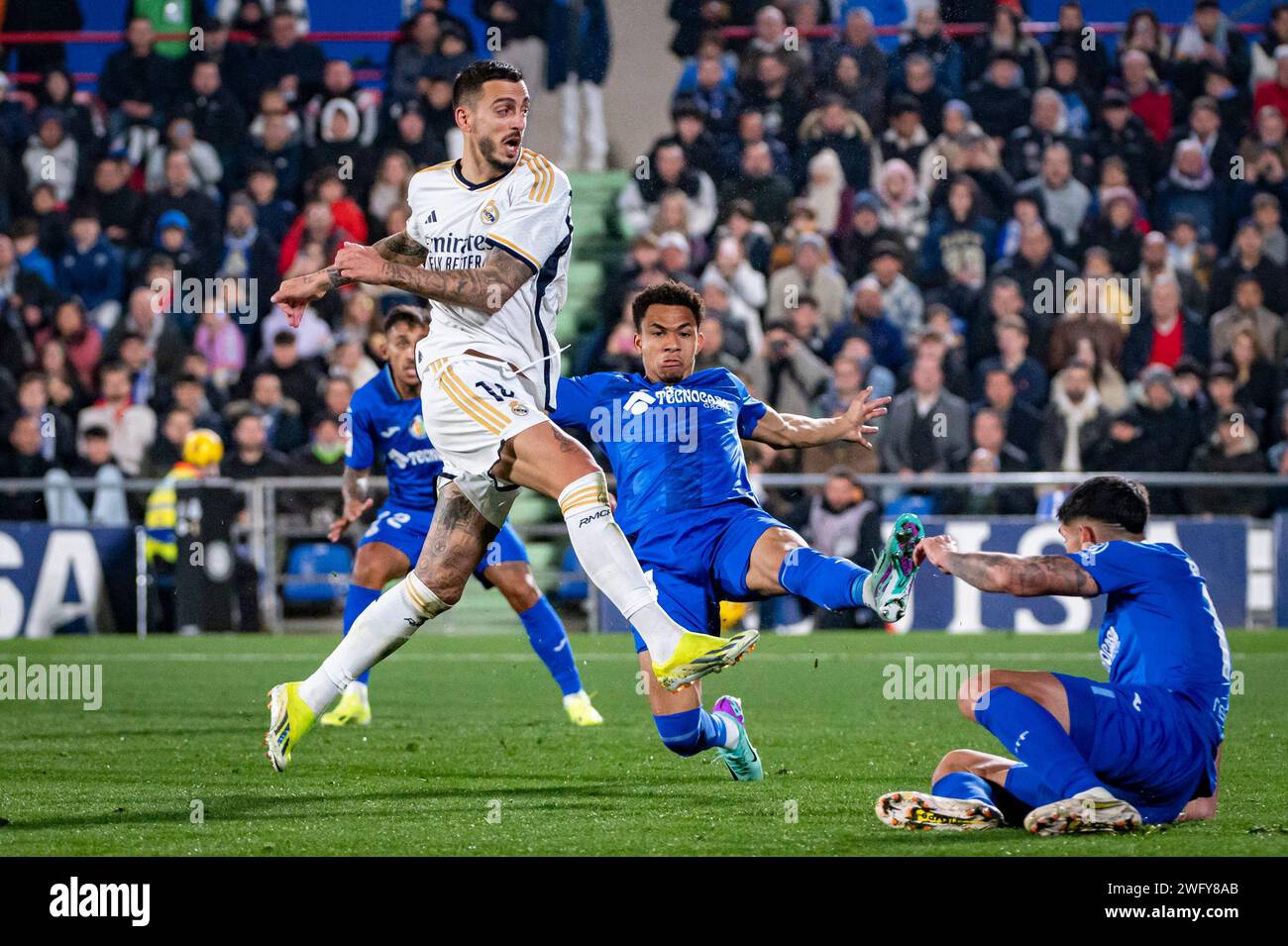 Getafe, Madrid, Spain. 1st Feb, 2024. Jose Luis Sanmartin Mato (Joselu) of Real Madrid seen tacking a kick during the La Liga EA Sports 2023/24 football match between Getafe vs Real Madrid at Coliseum stadium in Getafe, Spain. (Credit Image: © Alberto Gardin/ZUMA Press Wire) EDITORIAL USAGE ONLY! Not for Commercial USAGE! Stock Photo