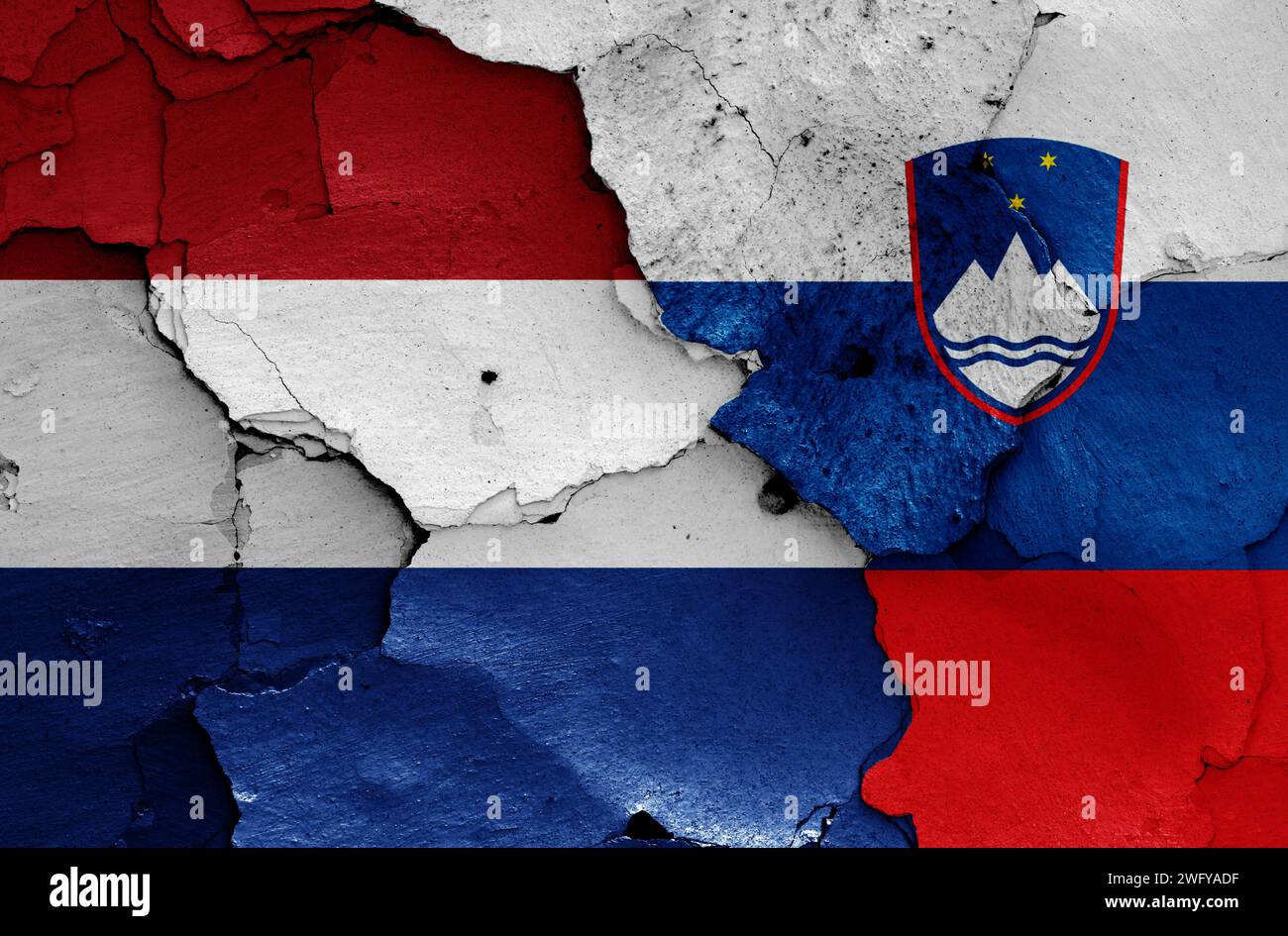 flags of Netherlands and Slovenia painted on cracked wall Stock Photo ...