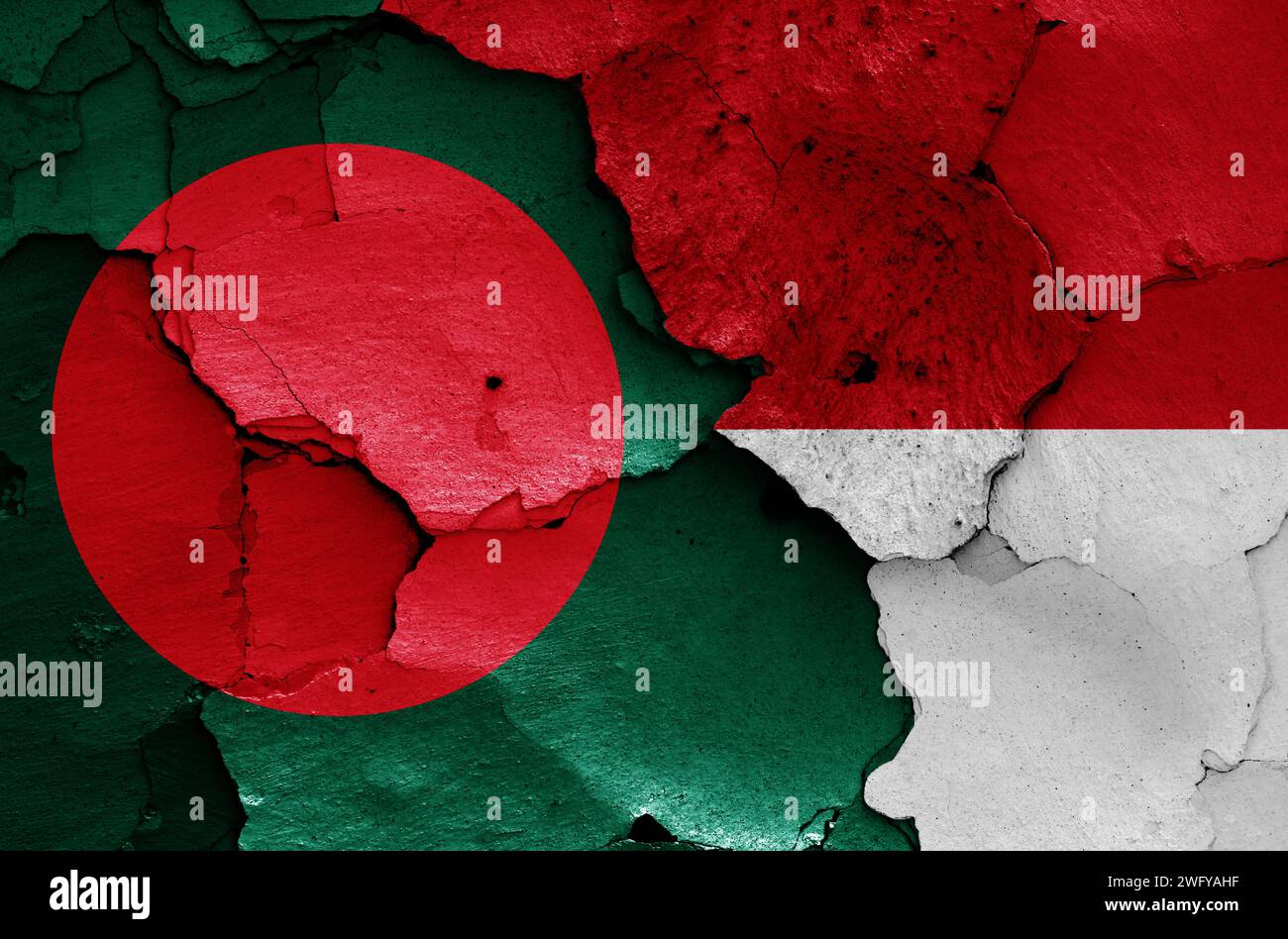 flags of Bangladesh and Indonesia painted on cracked wall Stock Photo