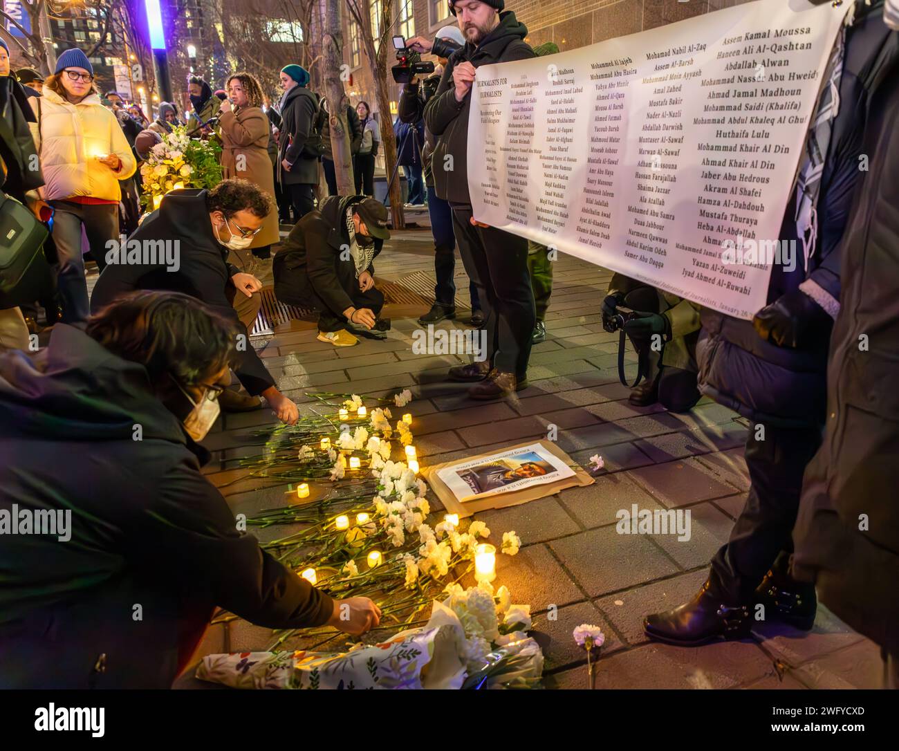 Toronto, Canada _ 1st Feb. 2024: Dozens of people attend a vigil for the scores of journalists killed while covering the ongoing violence in Israel and Gaza in downtown Toronto. Colin N. Perkel/Alamy Live News Stock Photo