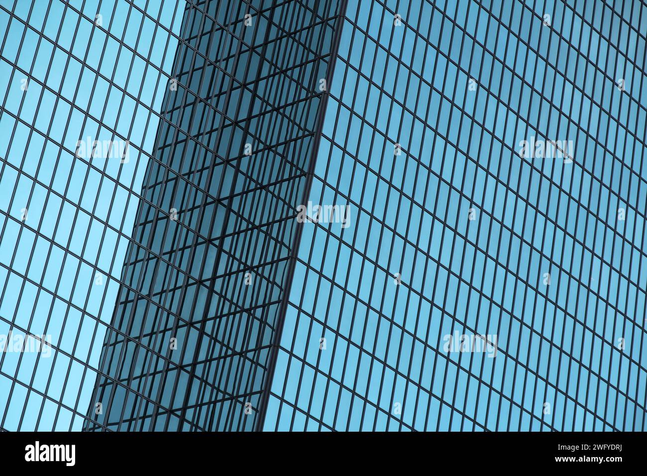 Blue glass high-rise building with reflections Stock Photo