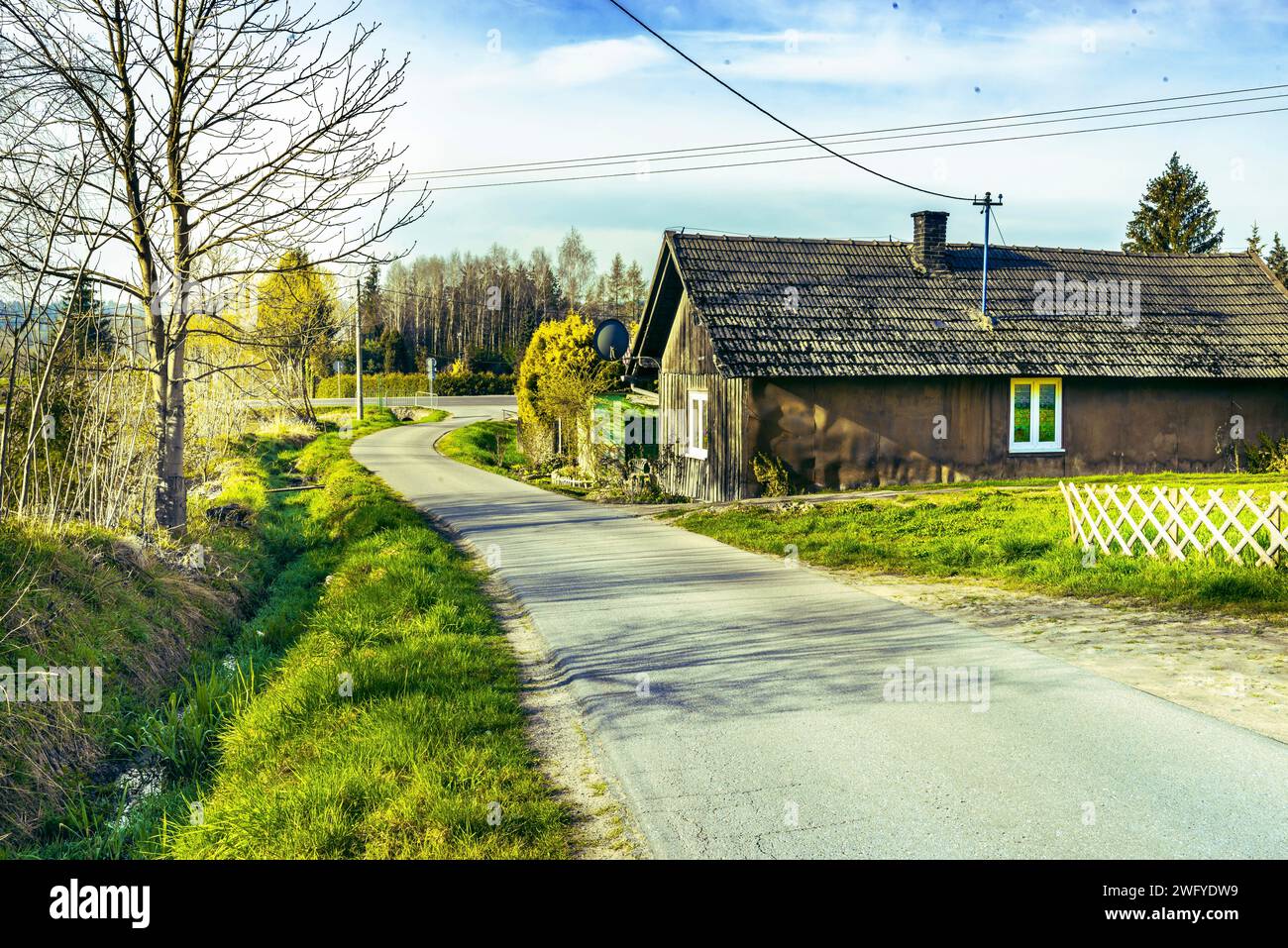 Old wooden house in the village. Rural landscape. Vintage style. Poland. Stock Photo