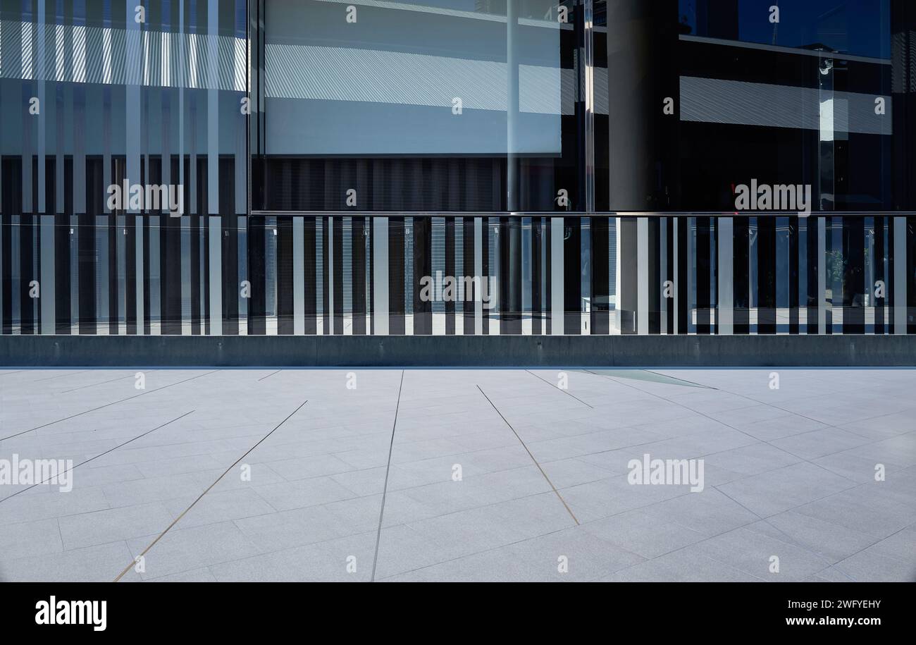 Empty floor with modern pattern glass wall of building exterior Stock Photo