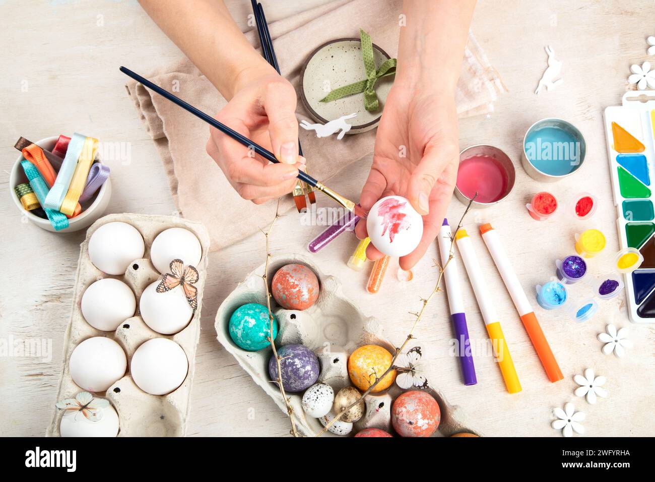DIY Easter egg painting. Holidays and creativity. Tradition concept. Stock Photo