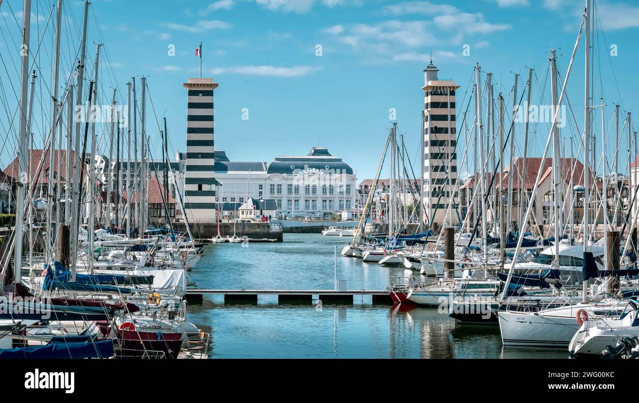 Some boats moored in the harbor with visible building Stock Photo - Alamy