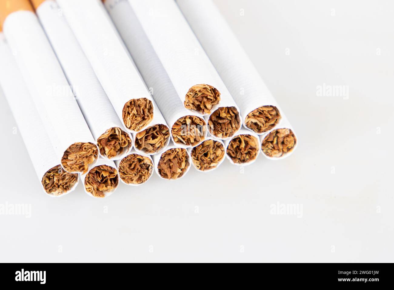 cigarettes stacked in pyramid detail tobacco on white background for World No Tobacco Day Stock Photo