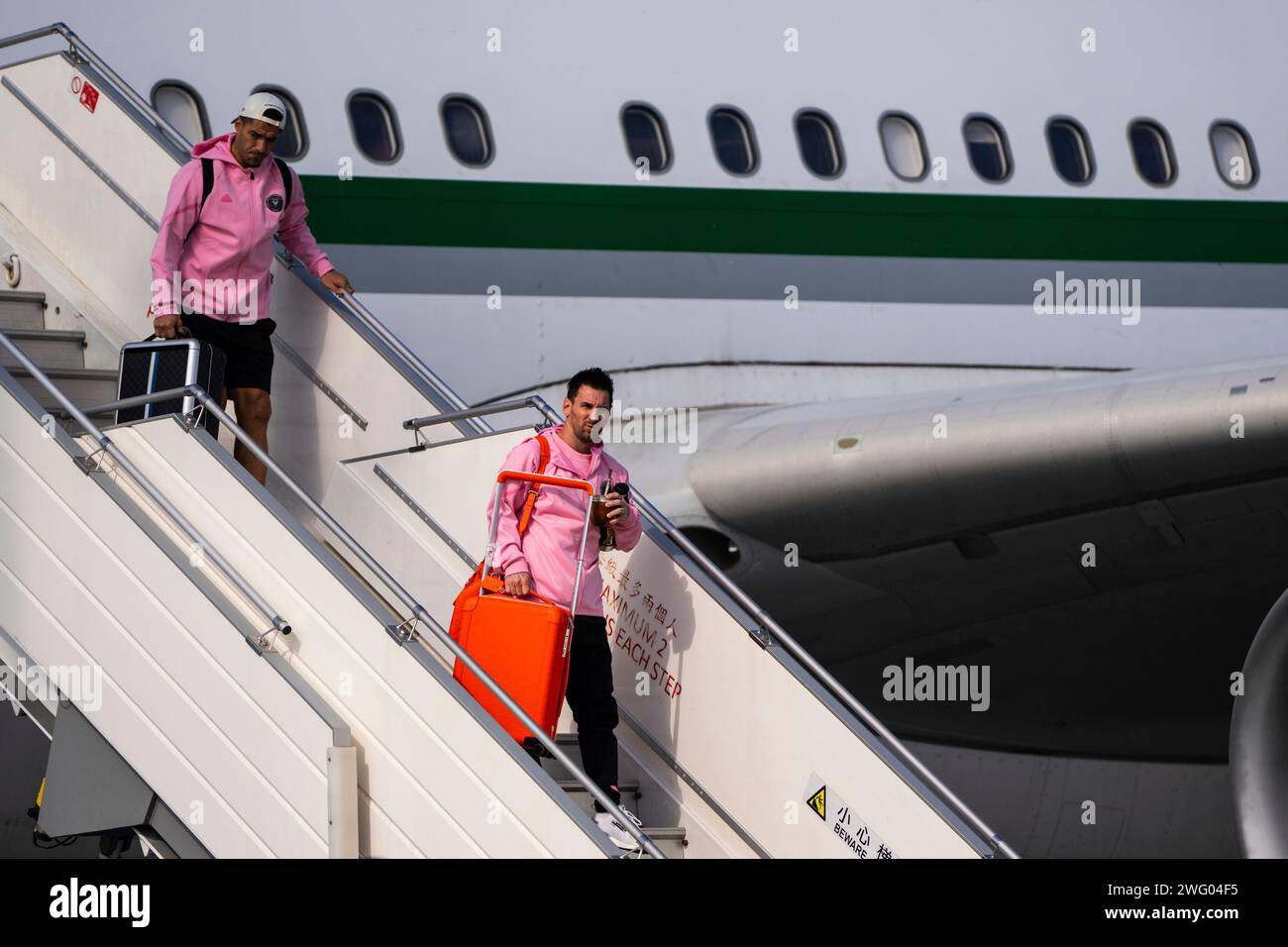 Luis Suarez Left And Lionel Messi Right Arrive At Hong Kong Luis suarez left and lionel messi right arrive at hong kong