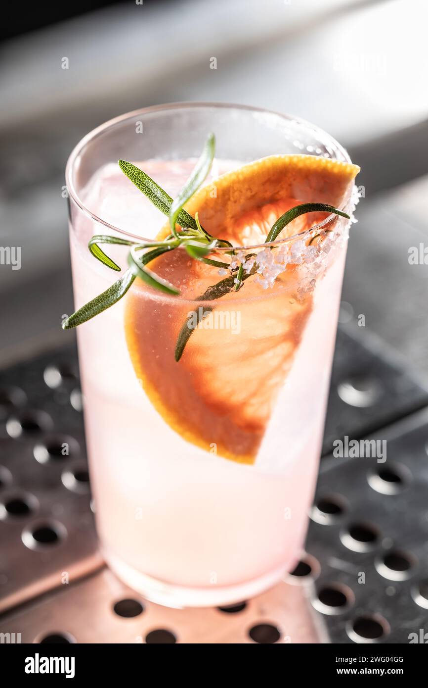 Cocktail drink Paloma with Gin grapefruit and soda decorated with