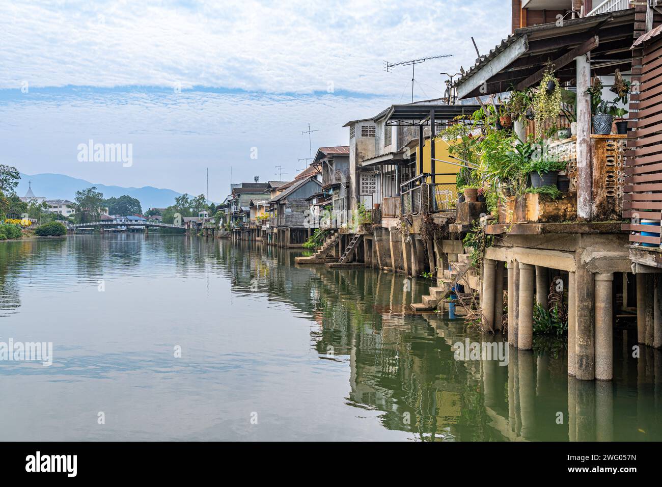Chantaburi, Thailand - January 27, 2024 - View of houses and buildings along the river in Chantaburi, Thailand on a bright cloudy morning Stock Photo