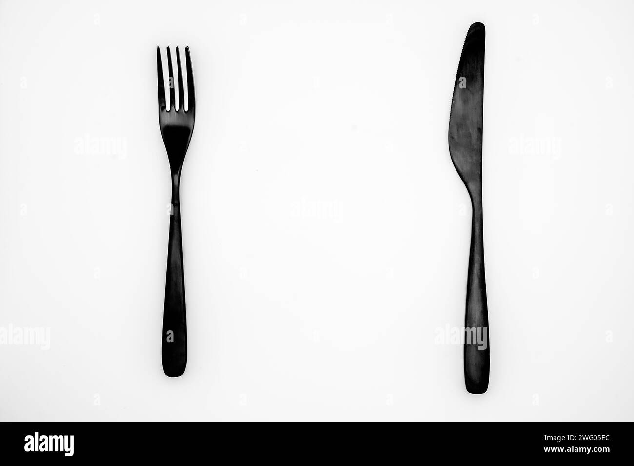 Black cutlery on white background Stock Photo Alamy
