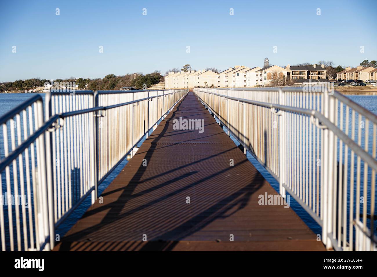 A dock on a cold morning at Lake Granbury at a small beach near the downtown square Stock Photo