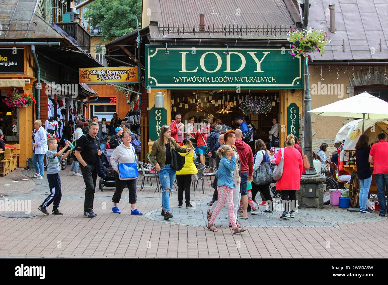 Tourists visiting Krupowki street in Zakopane, Poland. Stock Photo