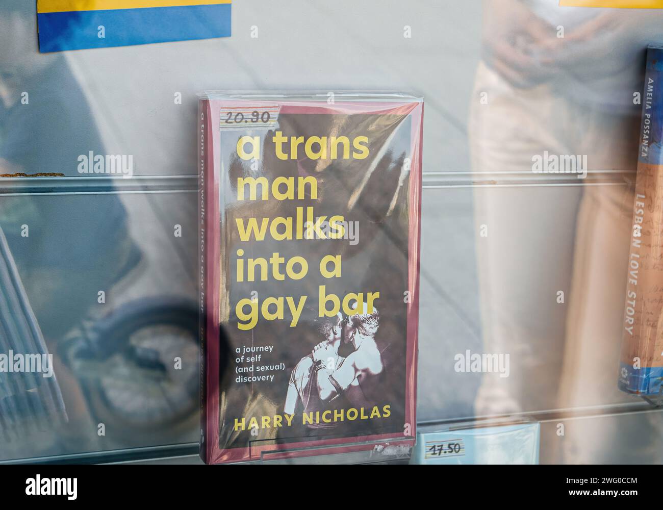 Strasbourg, France - Jul 2, 2023: A book titled A Trans Man Walks into a Gay Bar on display in a store window by Harry Nicholas Stock Photo