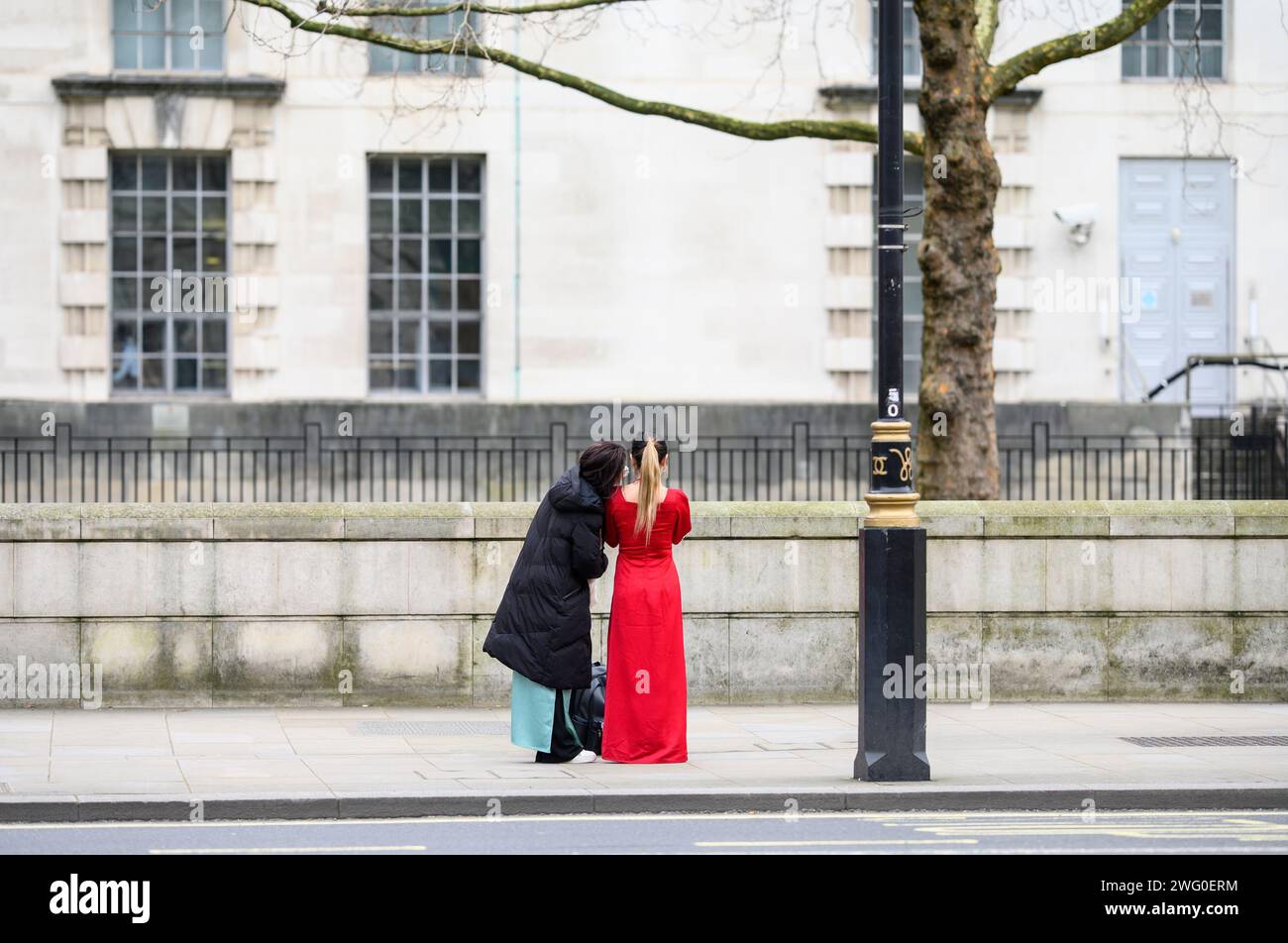 London, UK. Two Asian women taking a photo in Whitehall Stock Photo