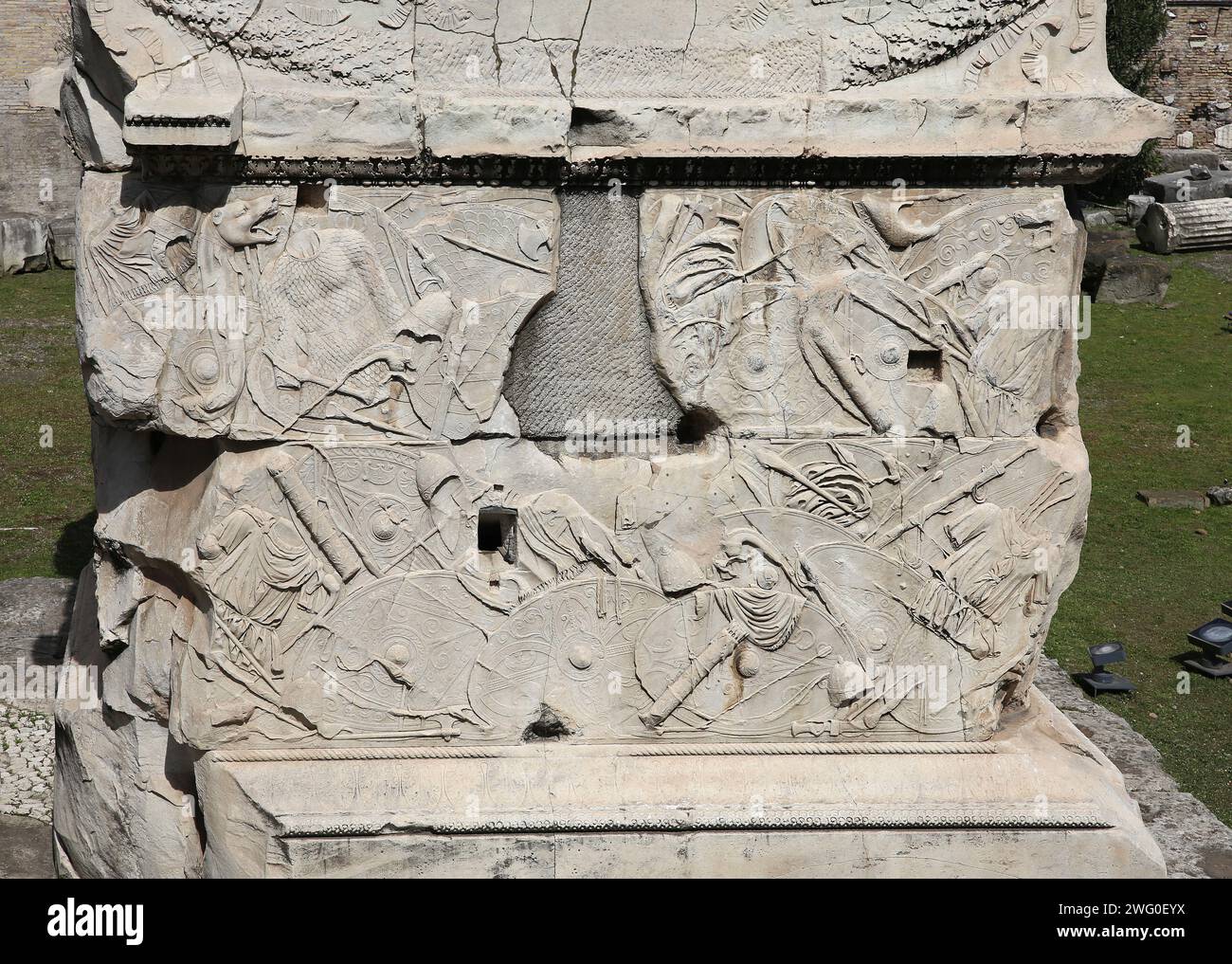 Italy. Rome. Trajan's Column. Roman triumphal column. Base with war trophies. Dacian Wars (2nd century). Stock Photo