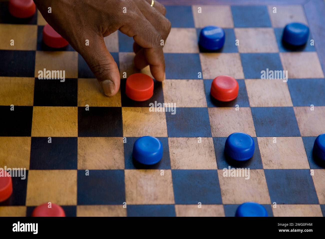The popular board game of Checkers ( Draughts ) being played in the back streets Stock Photo