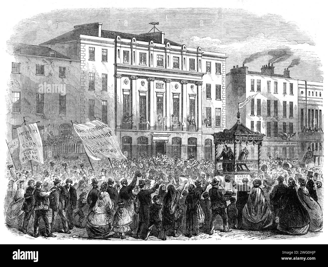 The Chairing of Sir John Arnott at Cork on the completion of his three years' mayoralty: the procession passing the Commercial Buildings, 1862. 'After the inauguration, on the 1st January, of Mr. Maguire, M.P., who has been elected Mayor of Cork for the present year, the city trades, to show their respect to Sir John Arnott, whose extensive charities have rendered him a general favourite, chaired him through the city, preceded by bands of music and the various symbols of their guilds'. Arnott was elected Lord Mayor of Cork three times, in 1859, 1860 and 1861. He was also Sheriff of Cork City i Stock Photo