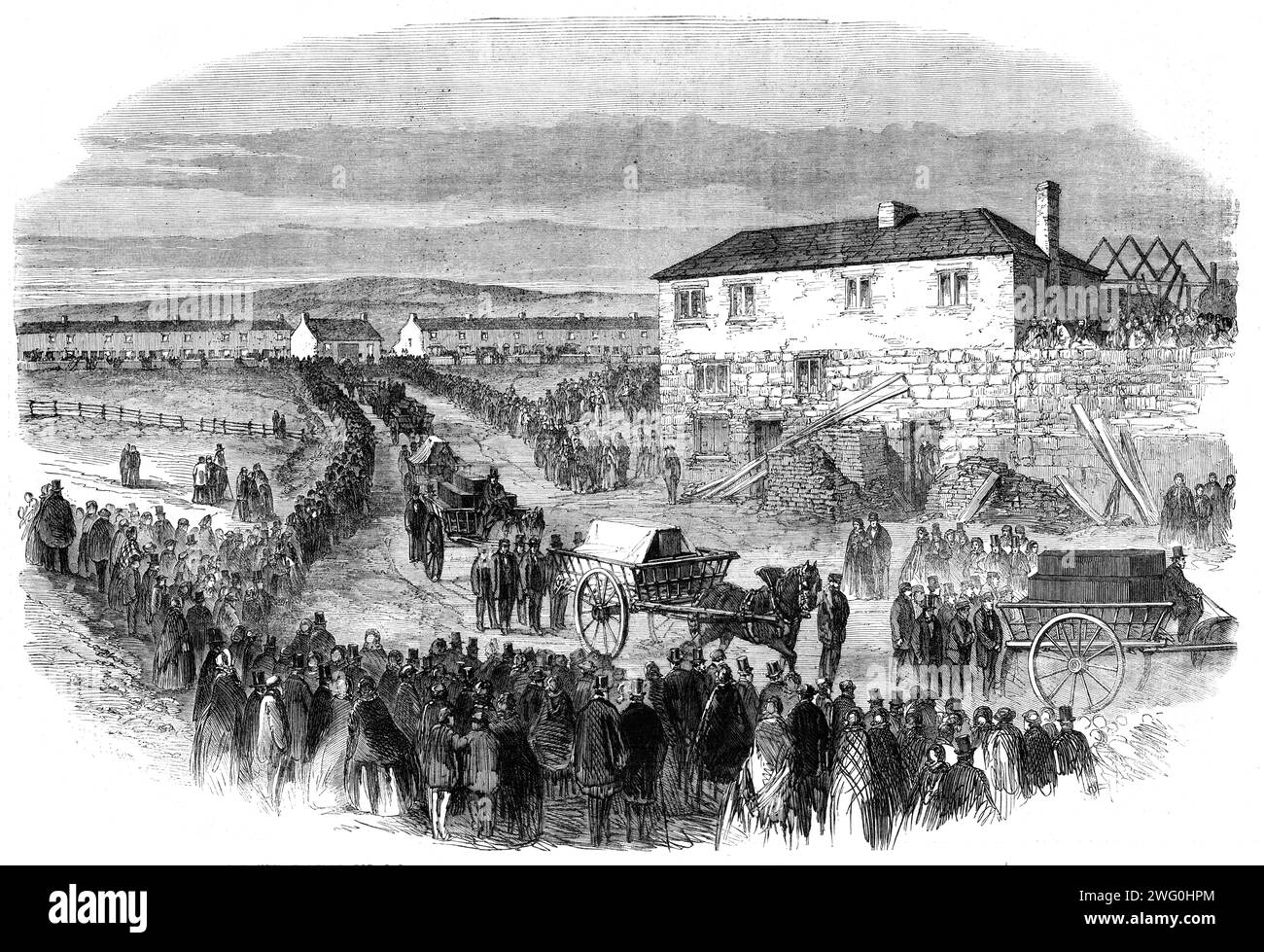 The New Hartley Pit Calamity: the funeral procession leaving Colliery Row for Earsdon Churchyard, 1862. The Hartley Colliery disaster of 16 January 1862 was a coal mining accident in Northumberland which resulted in the deaths of 204 men and children. '...there were probably 60,000 persons present...carts containing a layer of straw were slowly driven to the door of each cottage, and, amid the weeping and still more agonising signs of silent grief in every sorrowstricken house, the coffins were lifted over the side of the cart and packed in loads of five each...[by] three o'clock, nearly all t Stock Photo