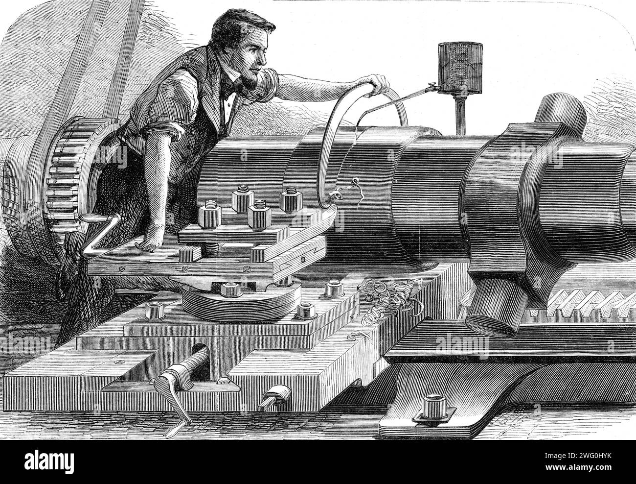 Manufacture of the Armstrong Gun at Woolwich Arsenal: finish-turning a 100-pounder, 1862. 'The gun, being now completely built up, is carried to a lathe for the purpose of being finish-turned, as is shown in our Illustration...This is performed in a portion of a lofty and extensive building, which we were told was formerly used as a foundry for the casting of the old pattern-guns, but has been transformed into two or three large shops, in which are powerful turning-lathes and other machines used in connection with the heavier class of guns. The workman in the Engraving is seen applying a gauge Stock Photo
