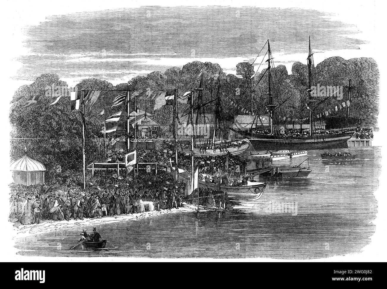 The launch of the Ipswich Life-Boat, 1862. Engraving from a photograph by Mr. Dixon Piper. 'It is calculated that from 30,000 to 40,000 persons attended...The life-boat, which has been built with much pains, and with the latest improvements, was drawn on its carriage by eight beautiful horses...through the principal streets, until it found its natural element in the broad stream of the Orwell...Mr. Thomas Baring, M.P., chairman of the institution, then said: This was a bright and encouraging day for the Royal National Lifeboat Institution...It was a source of great satisfaction to find that th Stock Photo