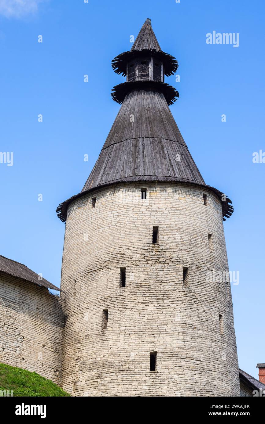 Stone tower and wall of the Kremlin of Pskov, Russia. Ancient coastal fortification, vertical photo Stock Photo