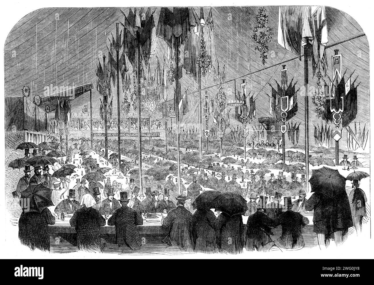 The Preston Guild Festival: the Royal North Lancashire Agricultural Society's dinner, 1862. 'The dinner on Wednesday afternoon was a grand success, so far as attendance was concerned. The congregation of 1700 people to satisfy the pangs of hunger presents an impressive scene, but when this force is seen to bivouac under umbrellas it becomes highly amusing. There is something unique in the sight of men thus sheltered performing gastronomic duets. What the rain could make uneatable was rendered so; but, as soon as the remainder had been discussed, Lord Derby - who had been conveyed from the Mayo Stock Photo