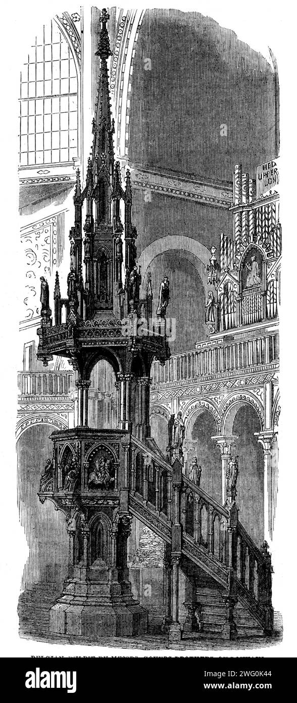 The International Exhibition: Belgian pulpit by Messrs. Goyers Brothers of Louvain, 1862. 'The Belgian carved pulpit...may be said to be fully an architectural structure, enriched with carved mouldings and subjects, and with the application of a small amount of coloured ornament. Around the body of the pulpit figure-subjects occur in full relief, the four panels being respectively filled by the Marriage of the Virgin, the Annunciation, the Greeting of Mary and Elizabeth, and the Flight into Egypt...The mouldings and capitals consist of foliage conventionally treated, and subordinated to its po Stock Photo