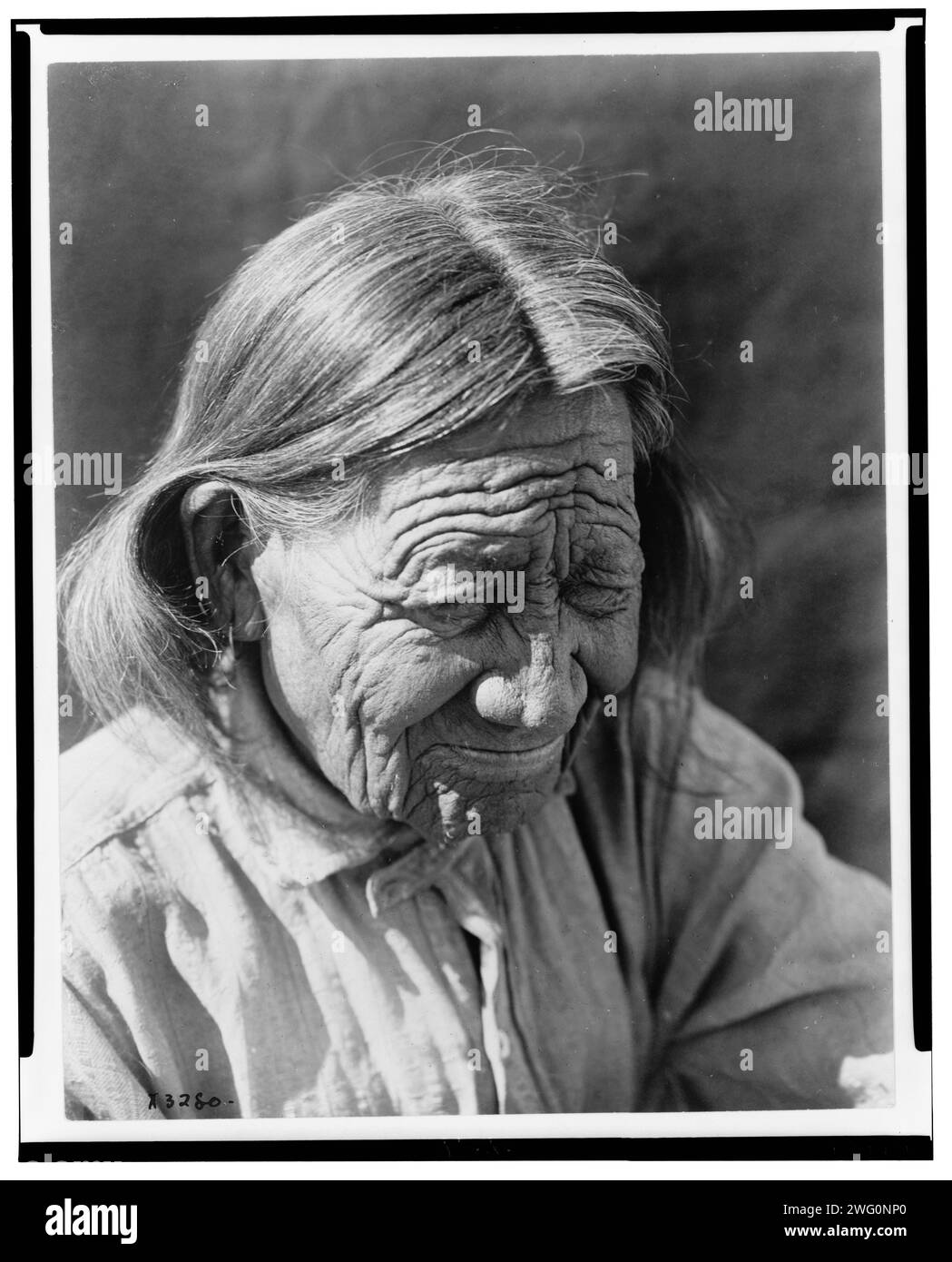 The ancient Arapaho, c1910. Arapaho person, head-and-shoulders portrait, looking downward to the right. Stock Photo