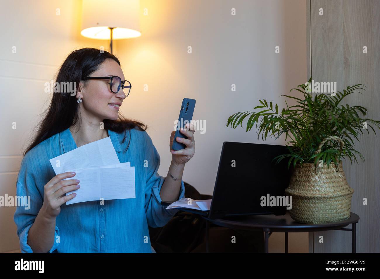 Girl Pays Bills At Home , Through App, Small Business, Online Tax Payment,Lifestyle Stock Photo