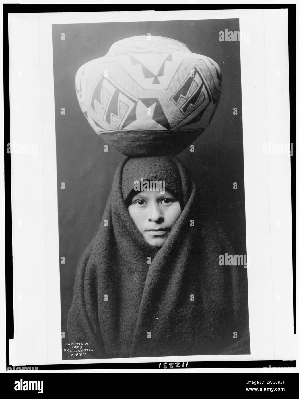 Zuni girl with jar, c1903. Headandshoulders portrait of Zuni girl