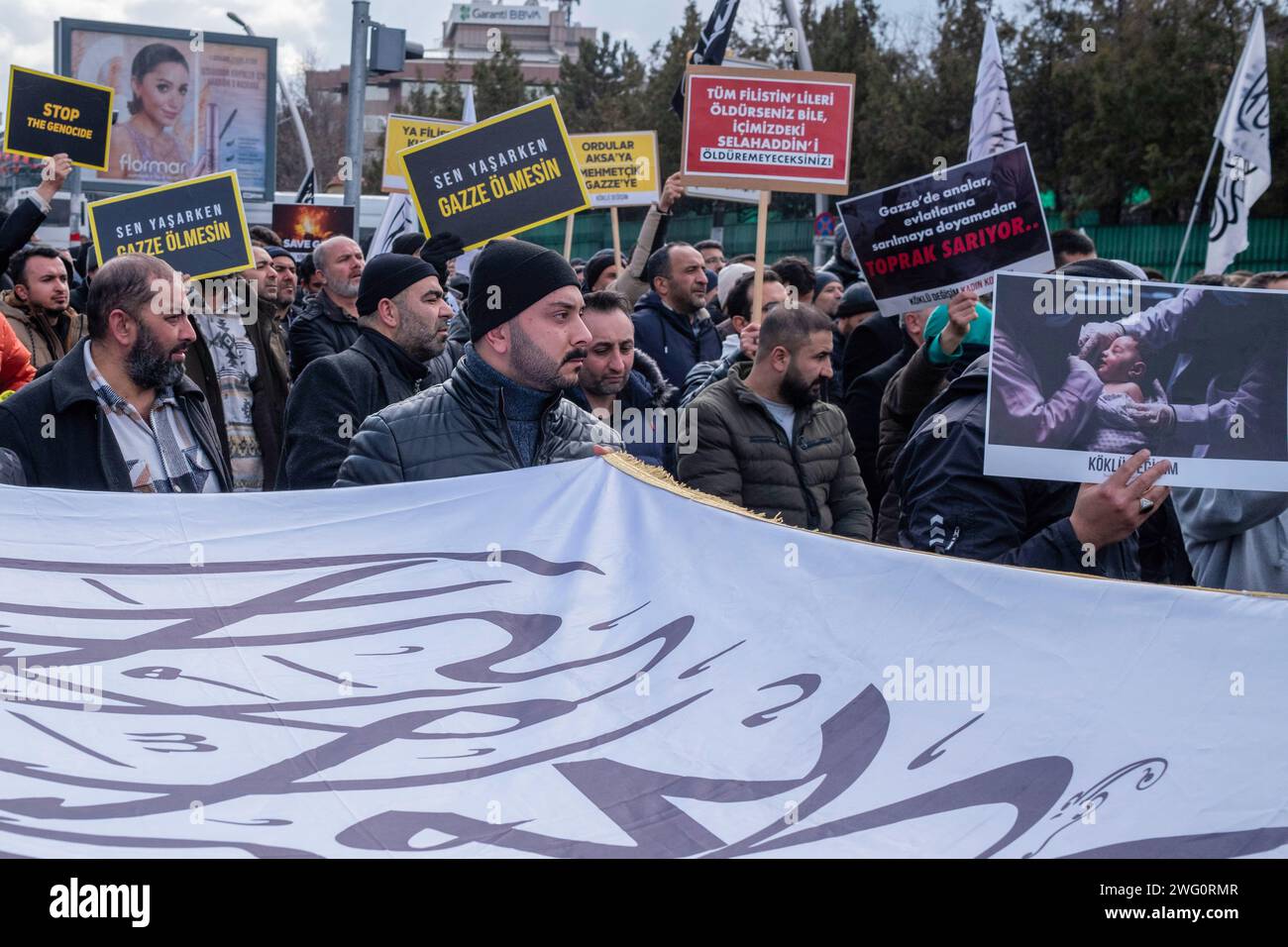 Ankara, Turkey. 28th Jan, 2024. Protesters hold a huge caliphate flag