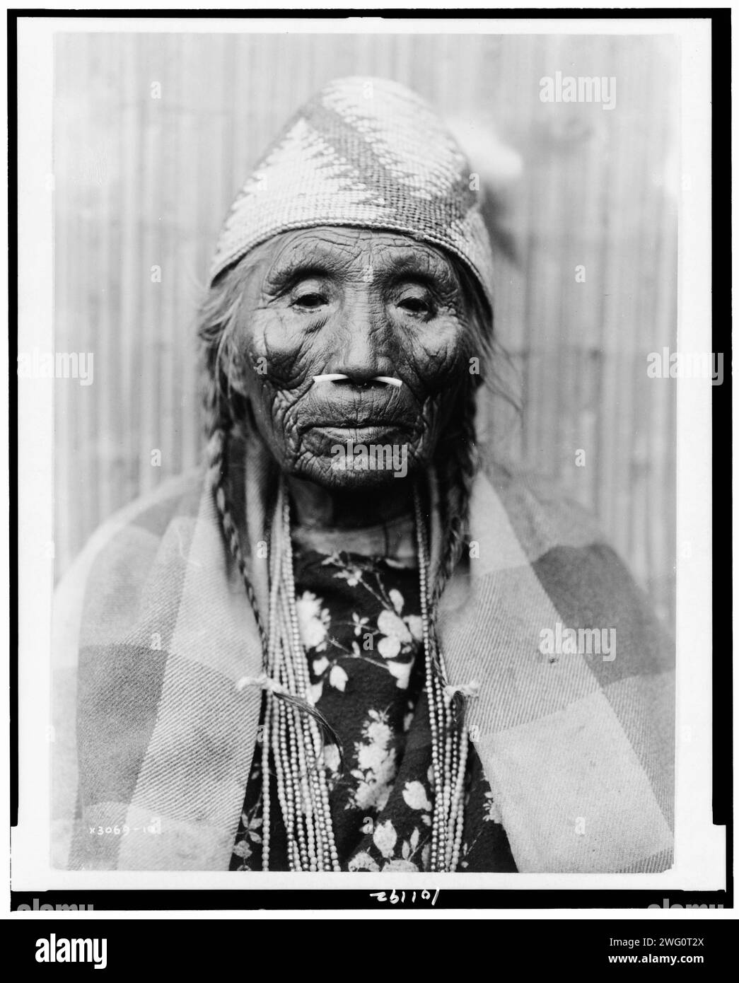 Wishram female type (front), 1910, c1915. Head-and-shoulders portrait of Tlakluit Indian woman, with bone in nose, facing front, Washington state. Stock Photo
