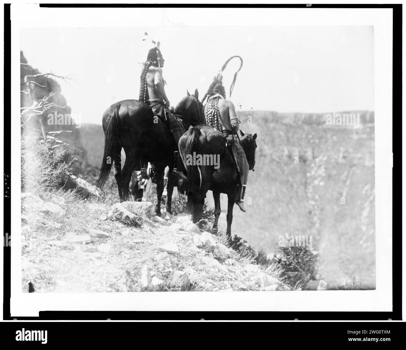 The Outlook, c1905. Packs The Hat and Which Way, two Crow Indians on horseback, Montana. Stock Photo