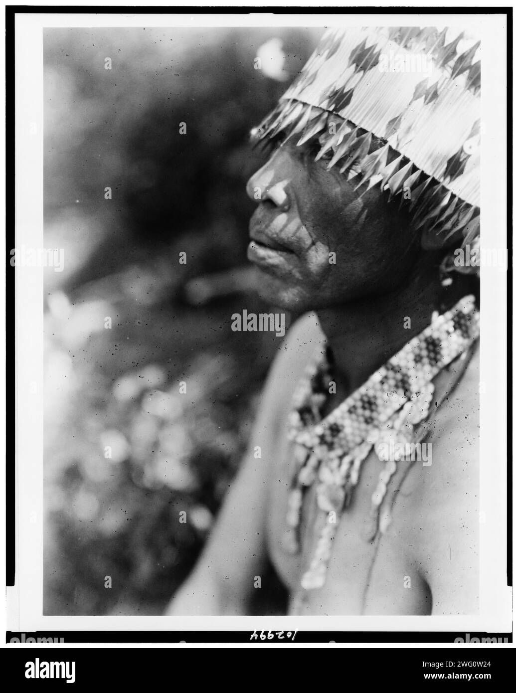 Coast Pomo with feather head-dress, c1924. Head-and-shoulders portrait, facing left. Stock Photo